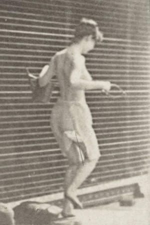 Woman Crossing Brook on Stepping-Stones with a Fishing Pole and a Can